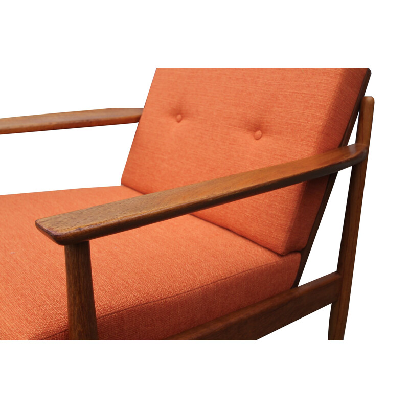 Vintage orange armchair in teak