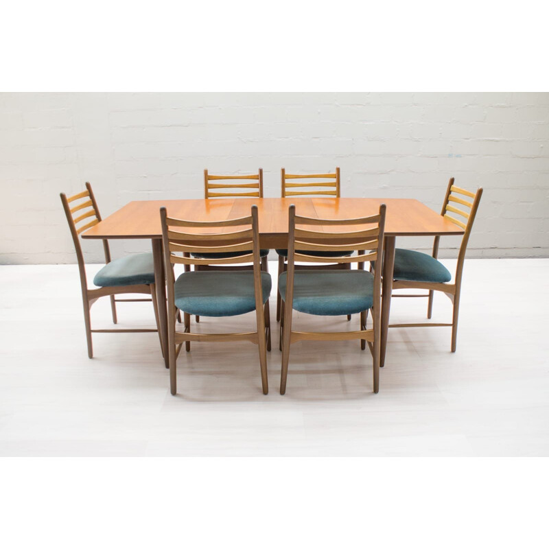 Set of vintage extendable teak table and 7 chairs 1960s