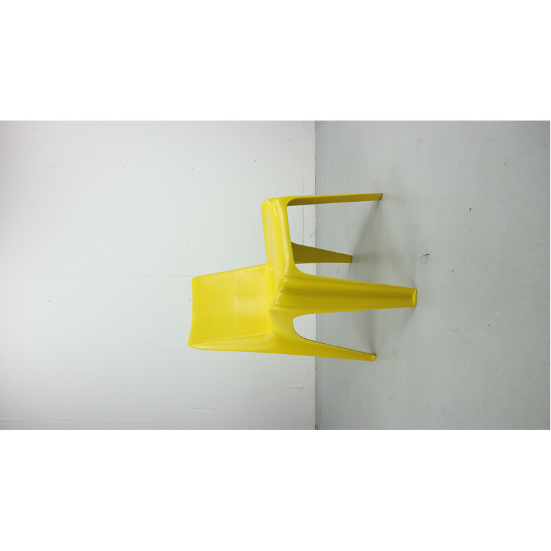 Yellow chair in fiberglass by Helmut Bätzner