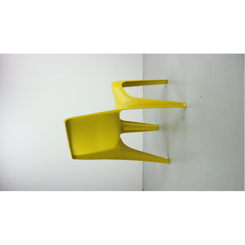 Yellow chair in fiberglass by Helmut Bätzner