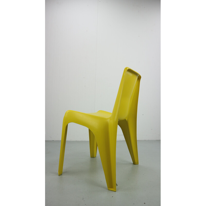 Yellow chair in fiberglass by Helmut Bätzner