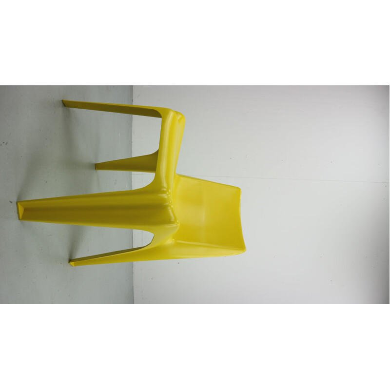 Yellow chair in fiberglass by Helmut Bätzner