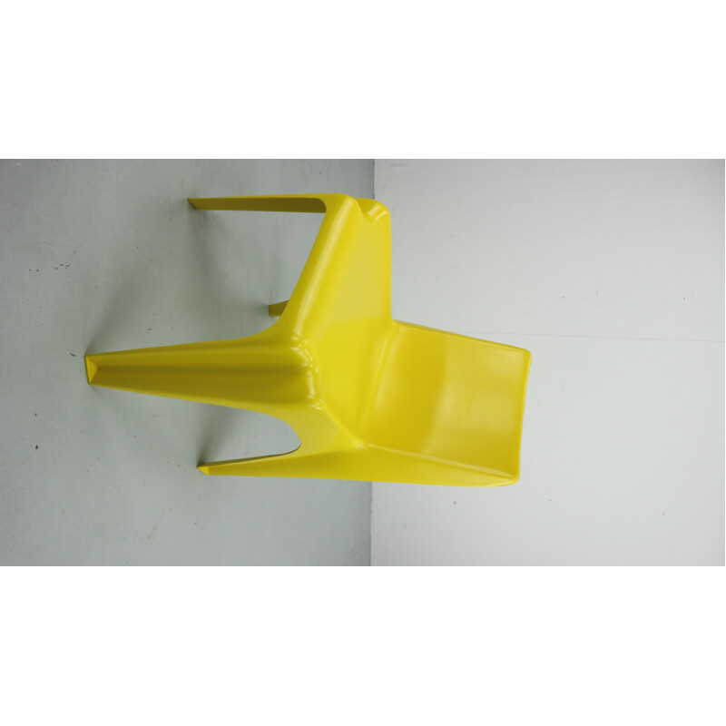 Yellow chair in fiberglass by Helmut Bätzner