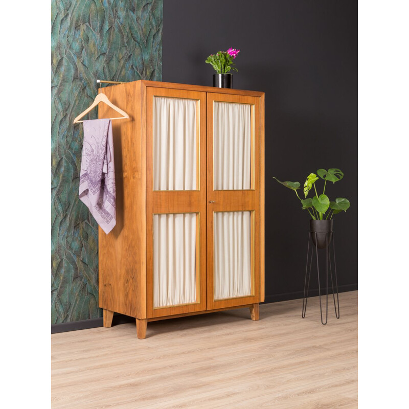 Vintage wardrobe for Musterring in walnut and with curtains 1950s