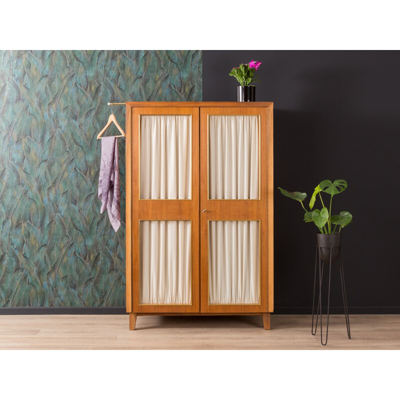 Vintage wardrobe for Musterring in walnut and with curtains 1950s