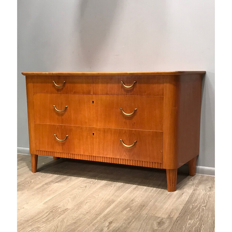 Wooden chest of drawers with brass handles