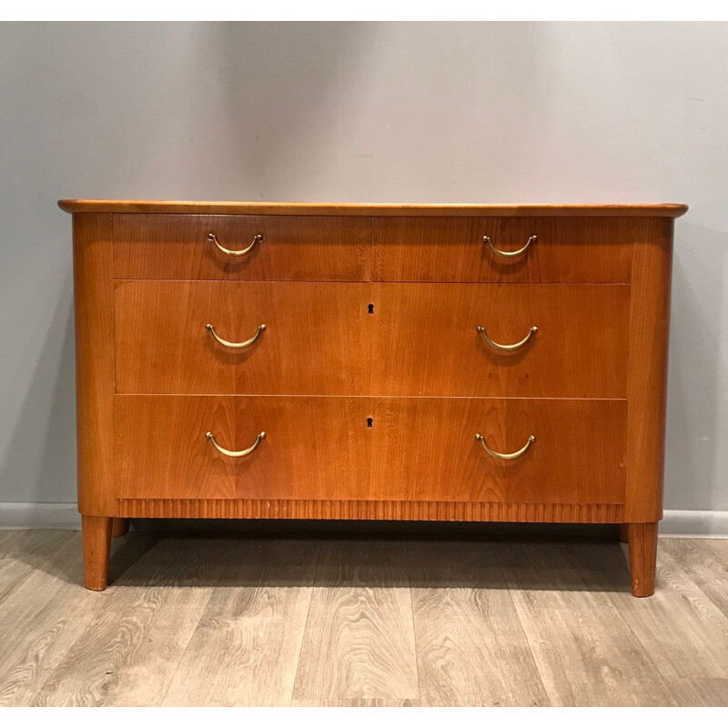 Wooden chest of drawers with brass handles