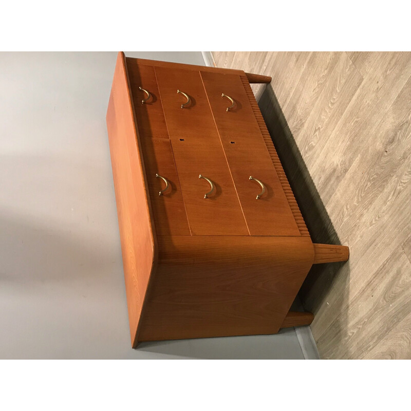 Wooden chest of drawers with brass handles