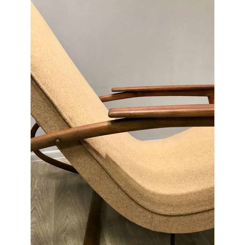 Rocking chair beige en bois courbé