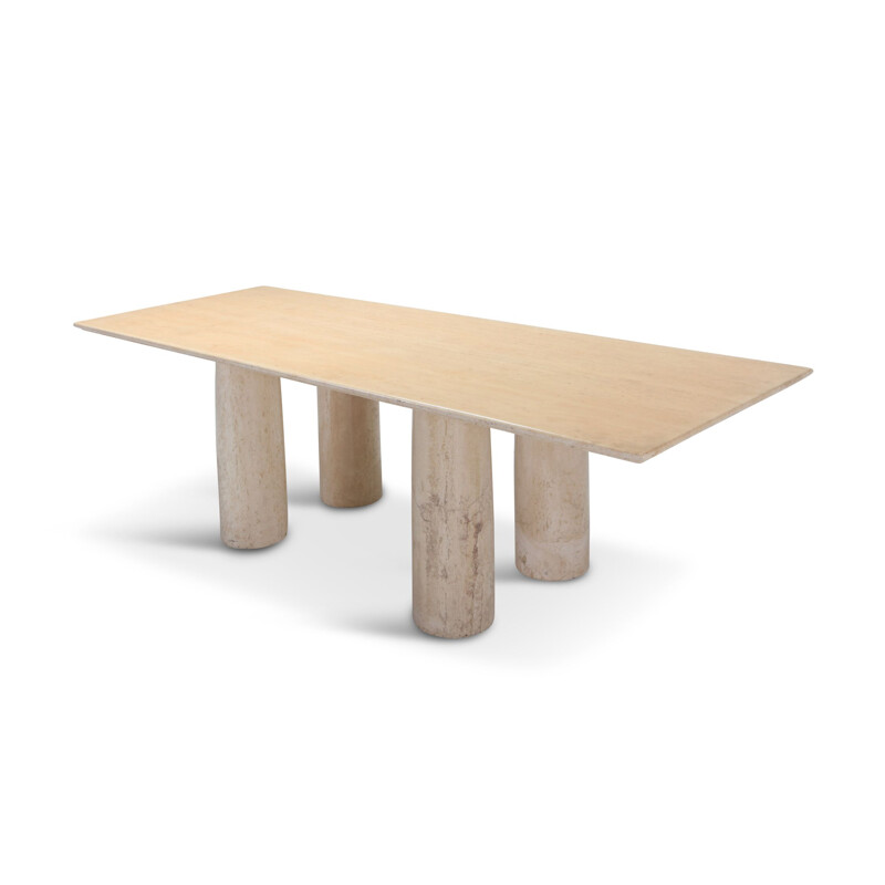 Dining table in travertine by Mario Bellini