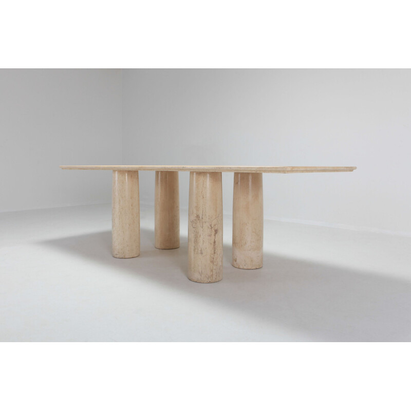 Dining table in travertine by Mario Bellini