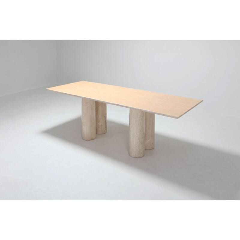 Dining table in travertine by Mario Bellini