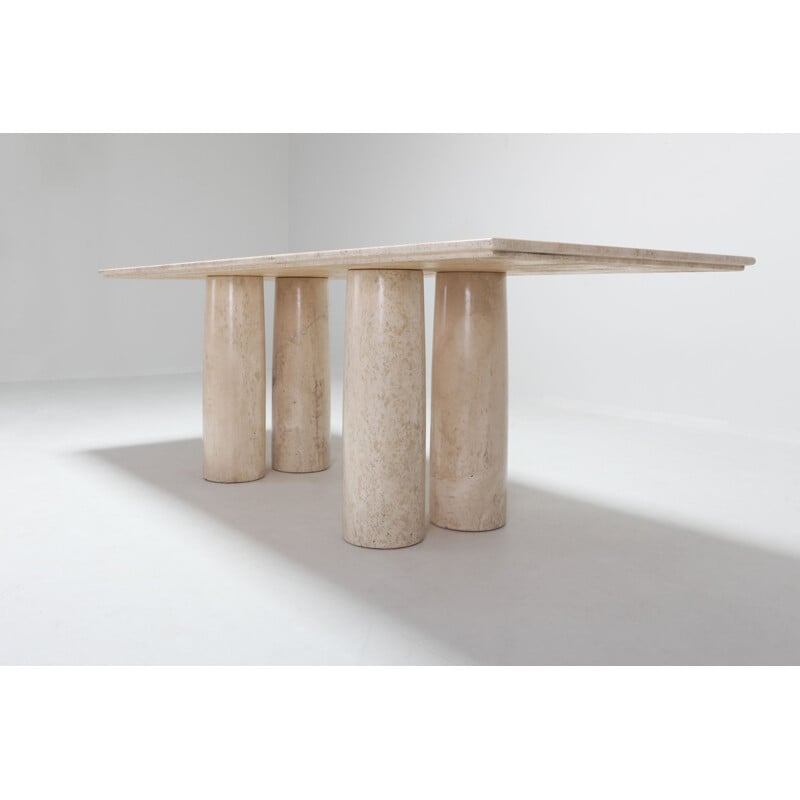 Dining table in travertine by Mario Bellini