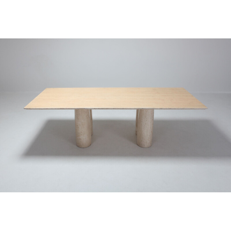 Dining table in travertine by Mario Bellini