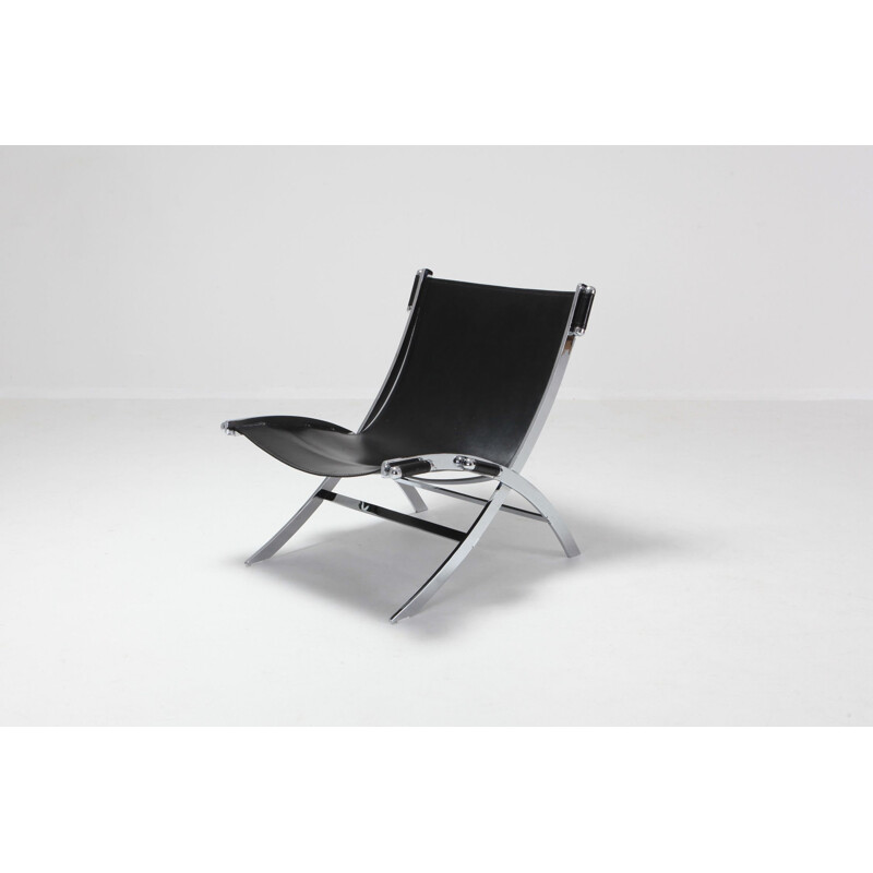 Vintage lounge chair in metal and black leather