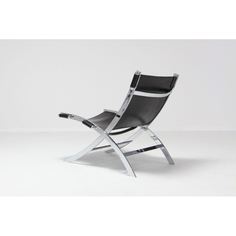 Vintage lounge chair in metal and black leather