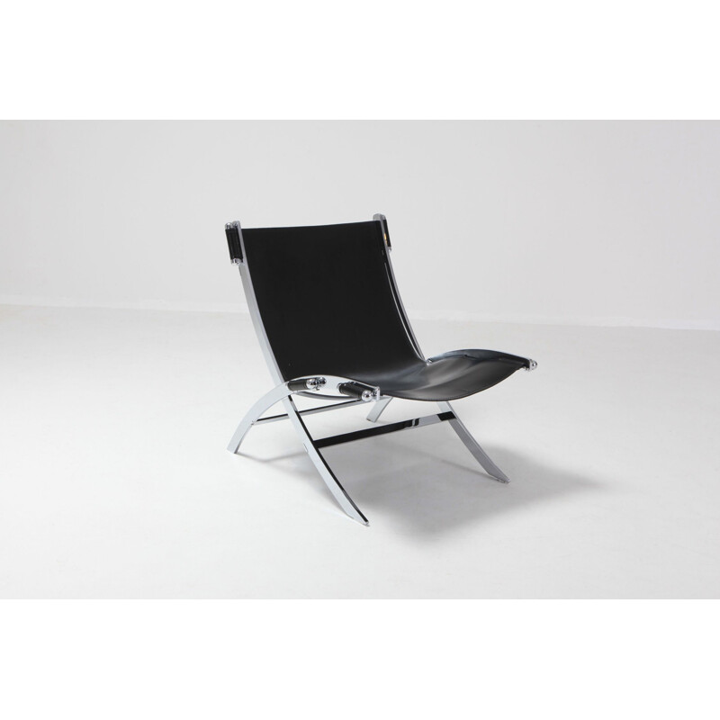 Vintage lounge chair in metal and black leather