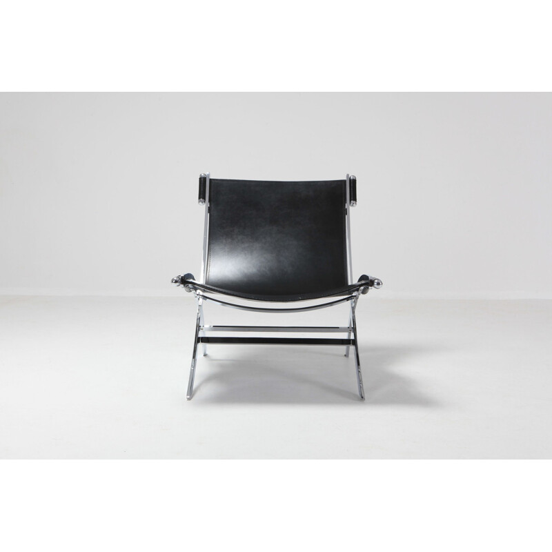 Vintage lounge chair in metal and black leather