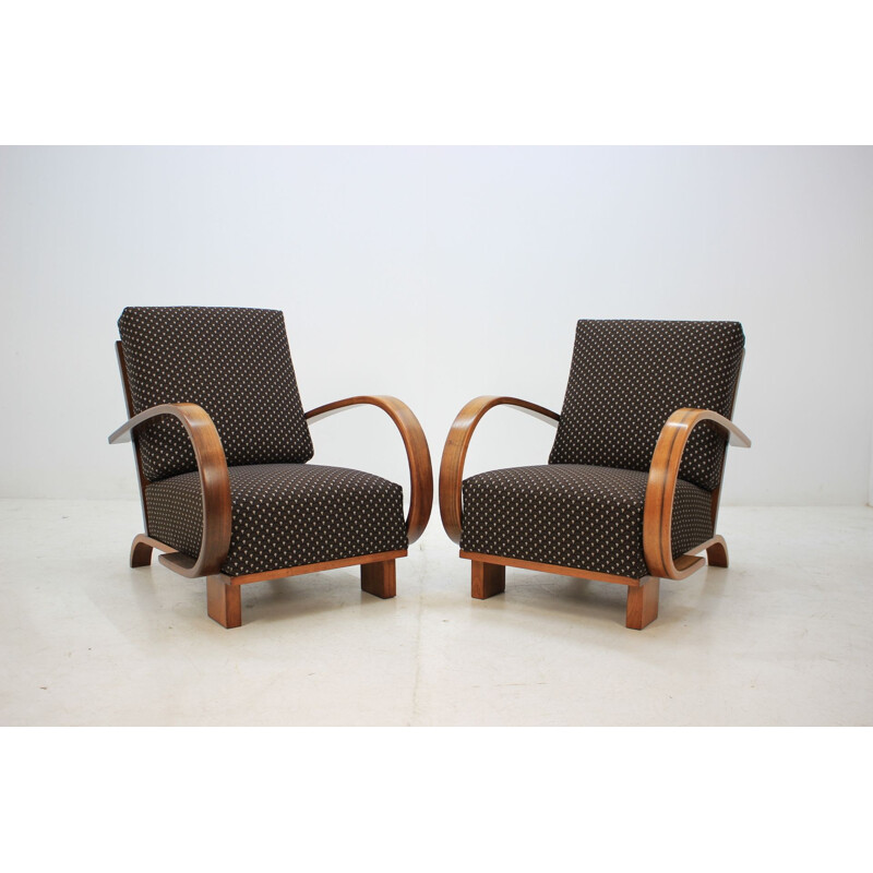 Pair of walnut armchairs by Jindrich Halabala