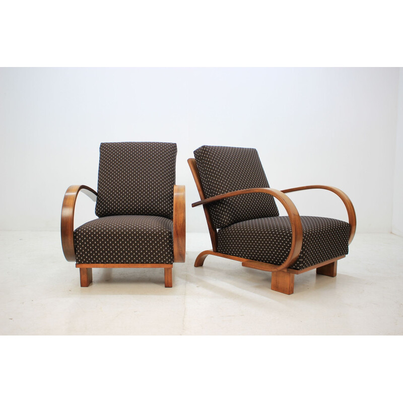 Pair of walnut armchairs by Jindrich Halabala