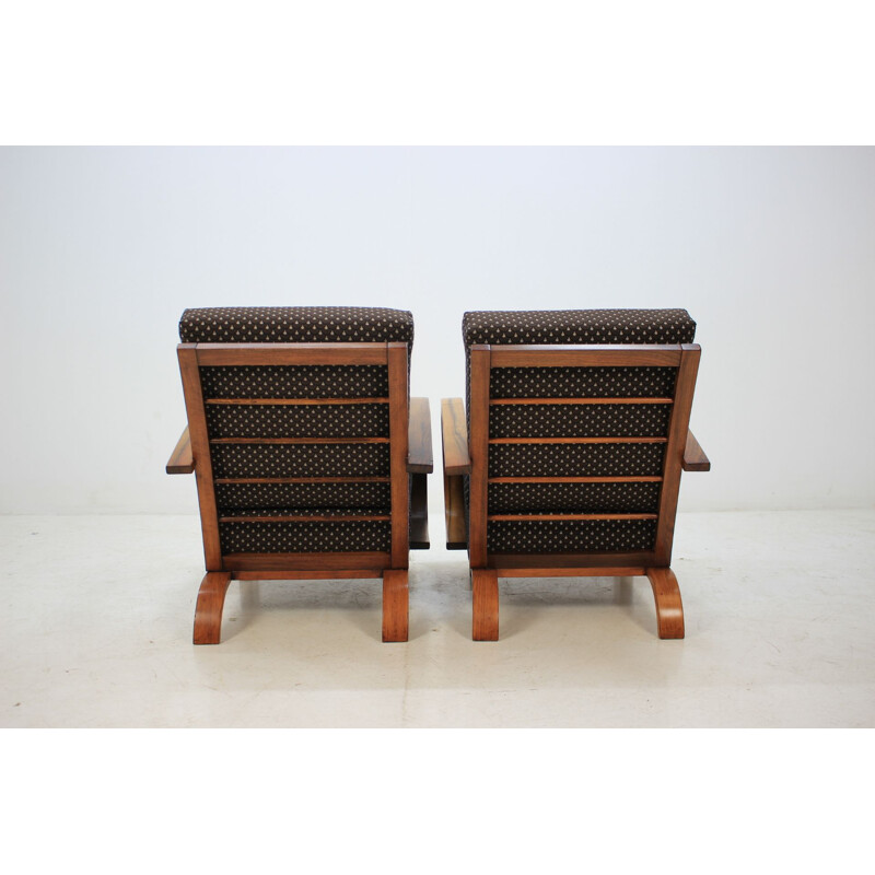 Pair of walnut armchairs by Jindrich Halabala