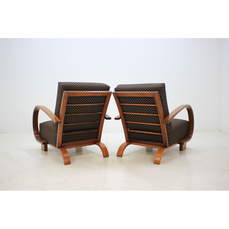 Pair of walnut armchairs by Jindrich Halabala