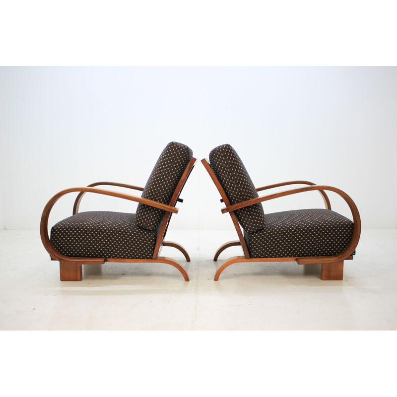 Pair of walnut armchairs by Jindrich Halabala