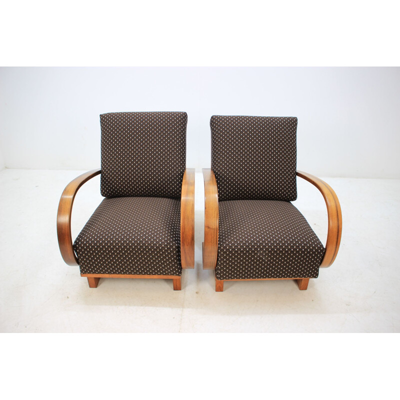 Pair of walnut armchairs by Jindrich Halabala