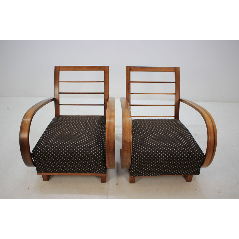 Pair of walnut armchairs by Jindrich Halabala