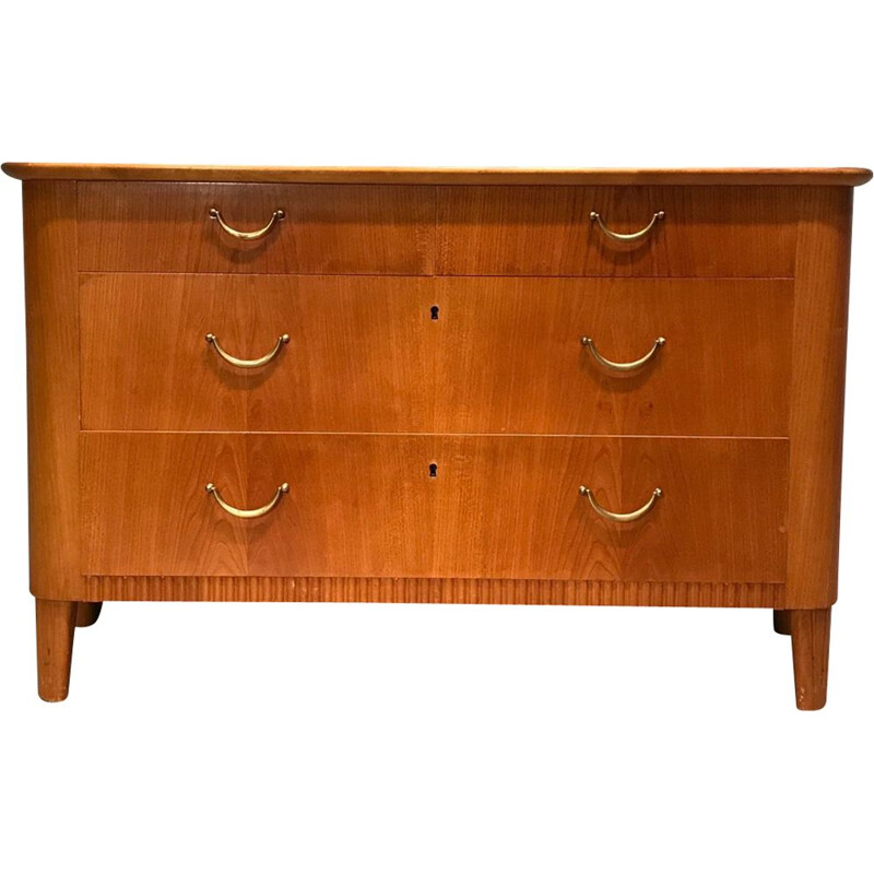 Wooden chest of drawers with brass handles