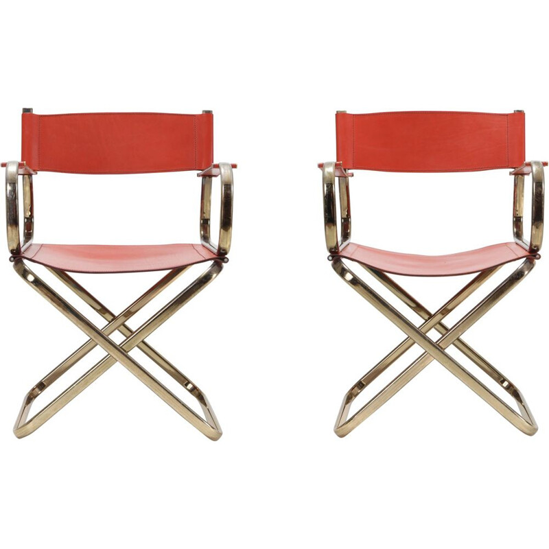 Pair of brass and red leather chairs