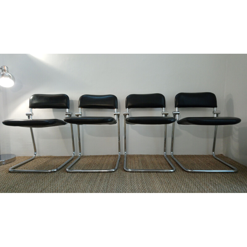 Conjunto de 4 sillas vintage en skai negro y cromo 1970
