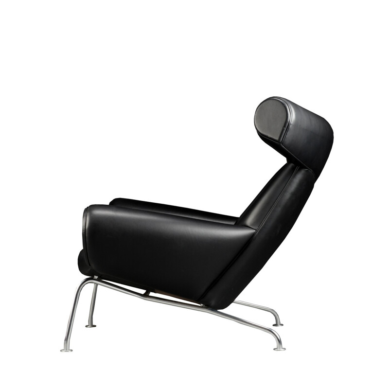 Leather and chromed steel armchair and its ottoman, Hans J. WEGNER - 1989