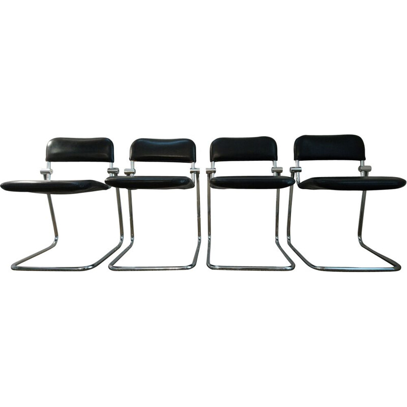 Suite de 4 chaises vintage en skai noir et chrome 1970