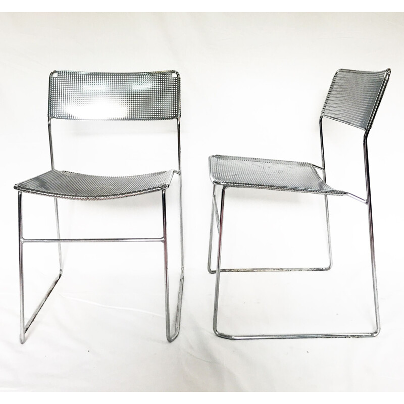 Set of 2 perforated chromed steel chairs by Niels Jorgen Haugesen for Magis