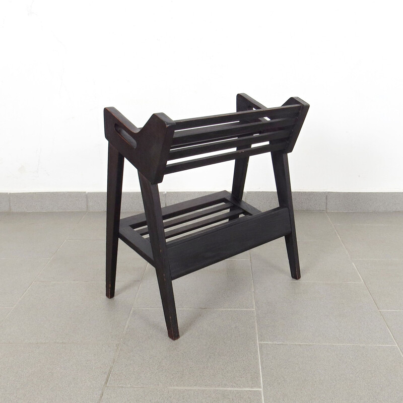 Black magazine rack by Krasna Jizba