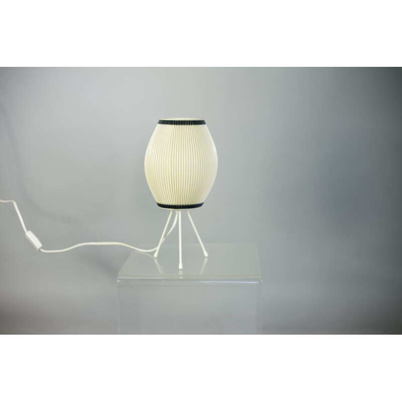 Beige tripod lamp in plastic