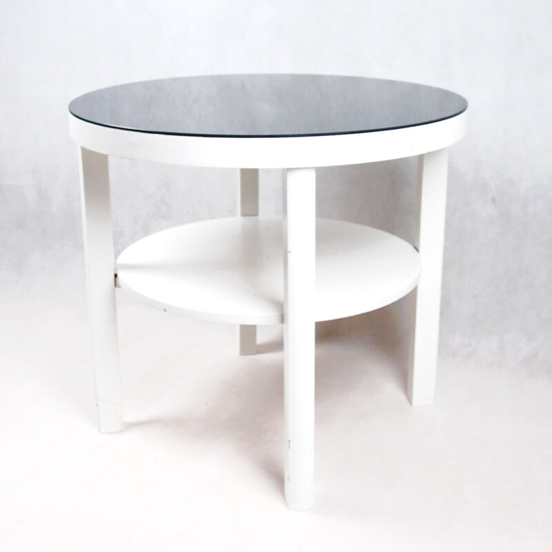 Table basse blanche avec plateau en verre noir