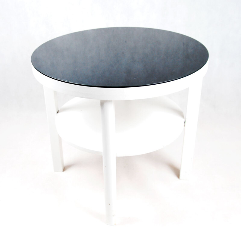 Table basse blanche avec plateau en verre noir