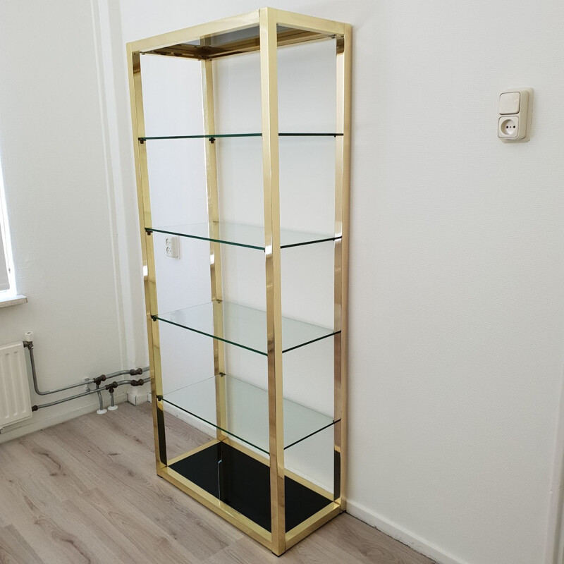 Vintage Italian gold plated shelving unit with clear and black glass