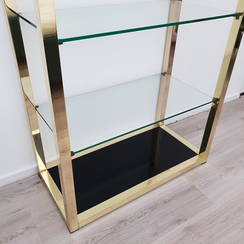 Vintage Italian gold plated shelving unit with clear and black glass