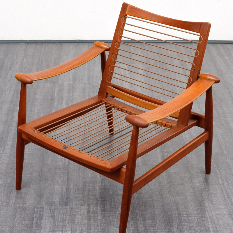 Red armchair by Finn Juhl for France & Son, model 133