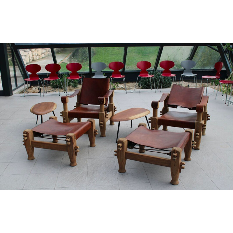 Pair of armchairs and ottomans in tawny leather laced 1960 s