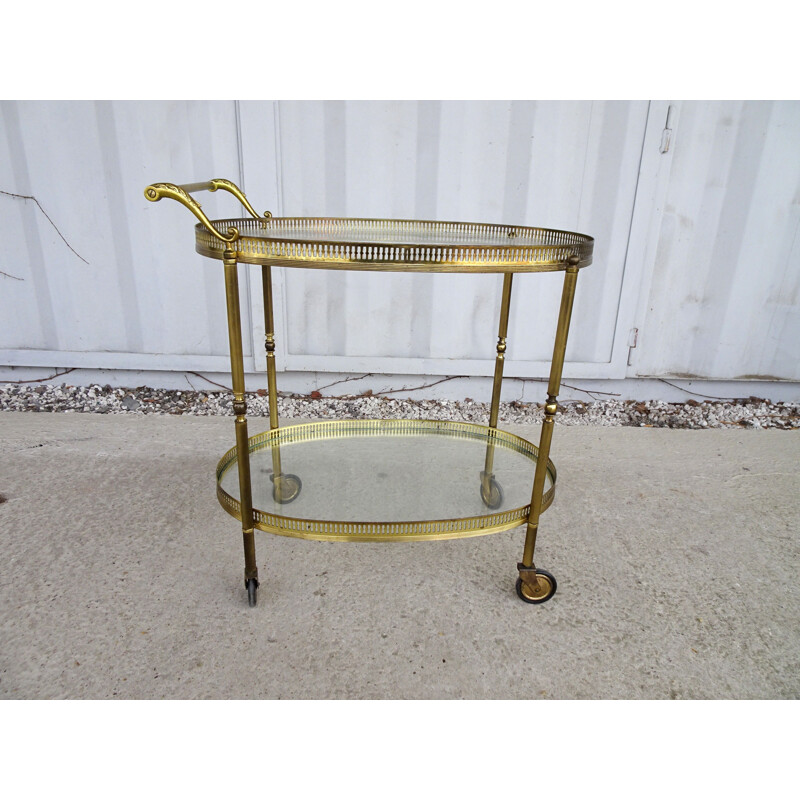 Vintage serving trolley golden with glass tops