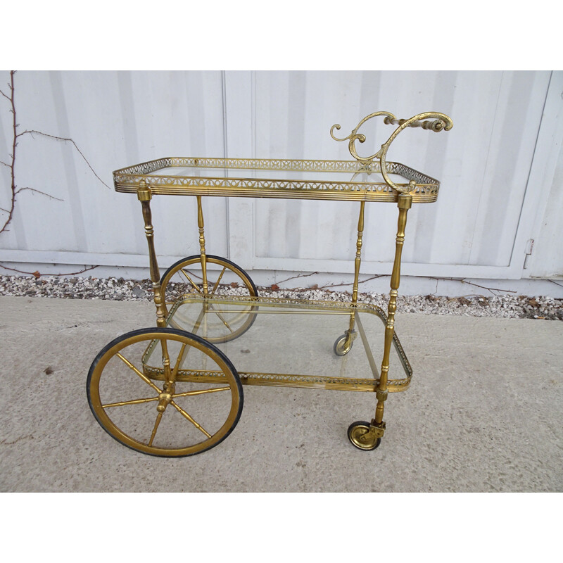 Vintage serving trolley in golden metal