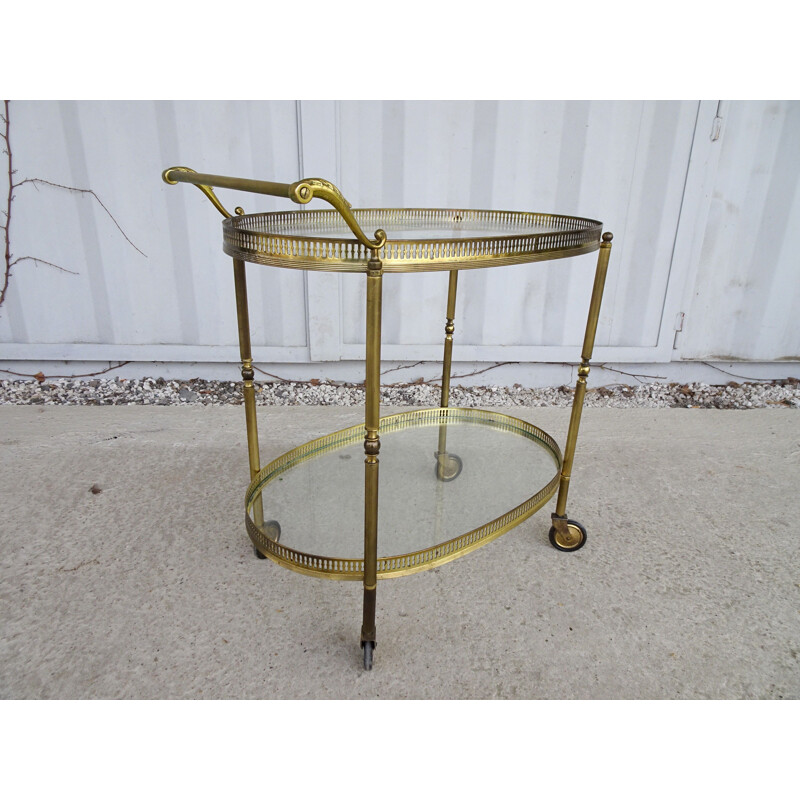 Vintage serving trolley golden with glass tops