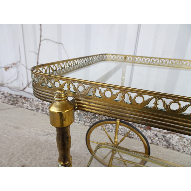 Vintage serving trolley in golden metal