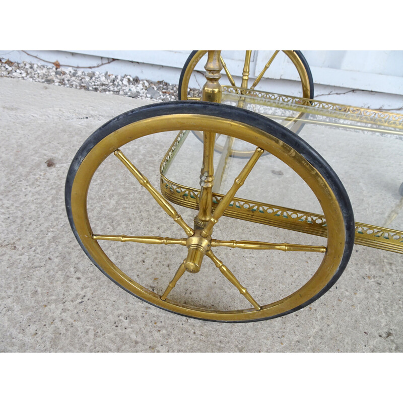 Vintage serving trolley in golden metal