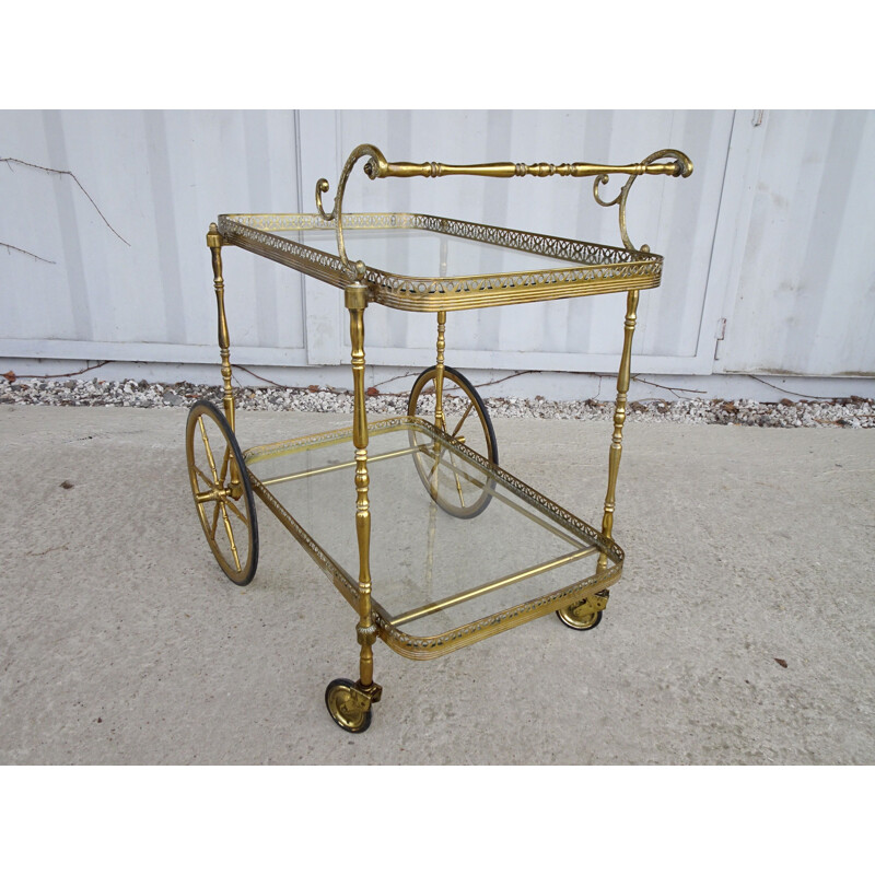 Vintage serving trolley in golden metal