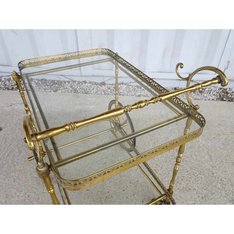 Vintage serving trolley in golden metal